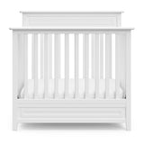 Storkcraft® Petal 4-in-1 Convertible Mini Crib with Bonus Water-Resistant Mattress.
