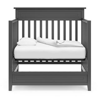 gray mini crib in daybed conversion 