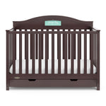 Front view of espresso crib with drawer