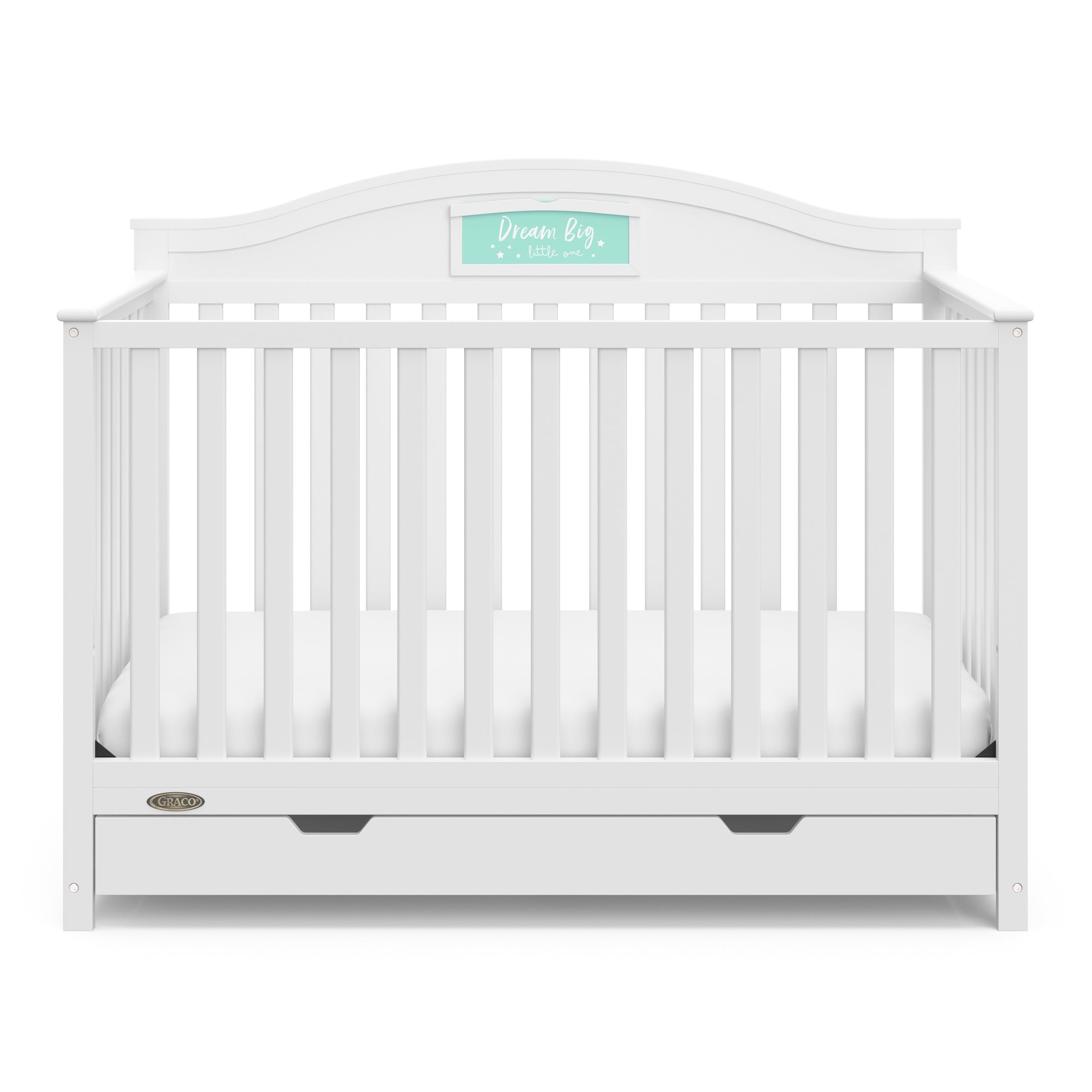 Front view of white crib with drawer