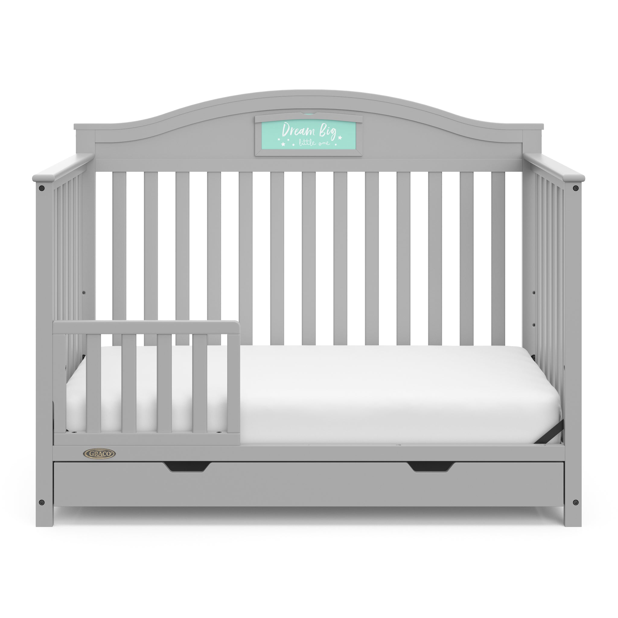Pebble gray crib with drawer in toddler bed conversion with one safety guardrail